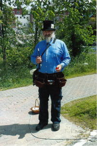 Jim Macdonald, Illusionist, busking at the Littleton, NH, Farmers' Market